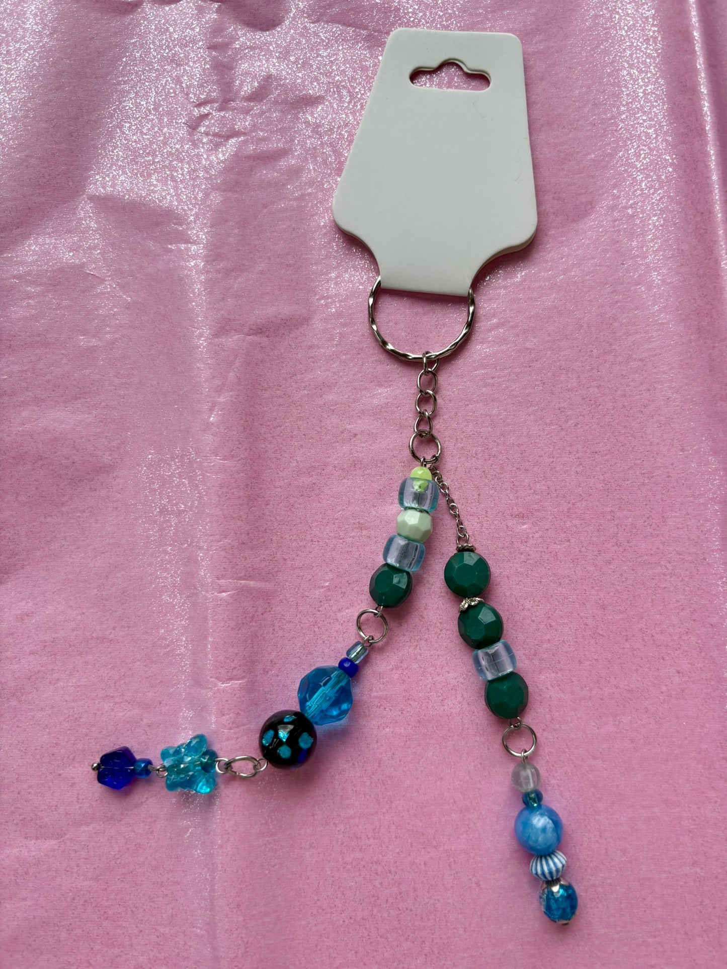 Beaded keychain on a pink background