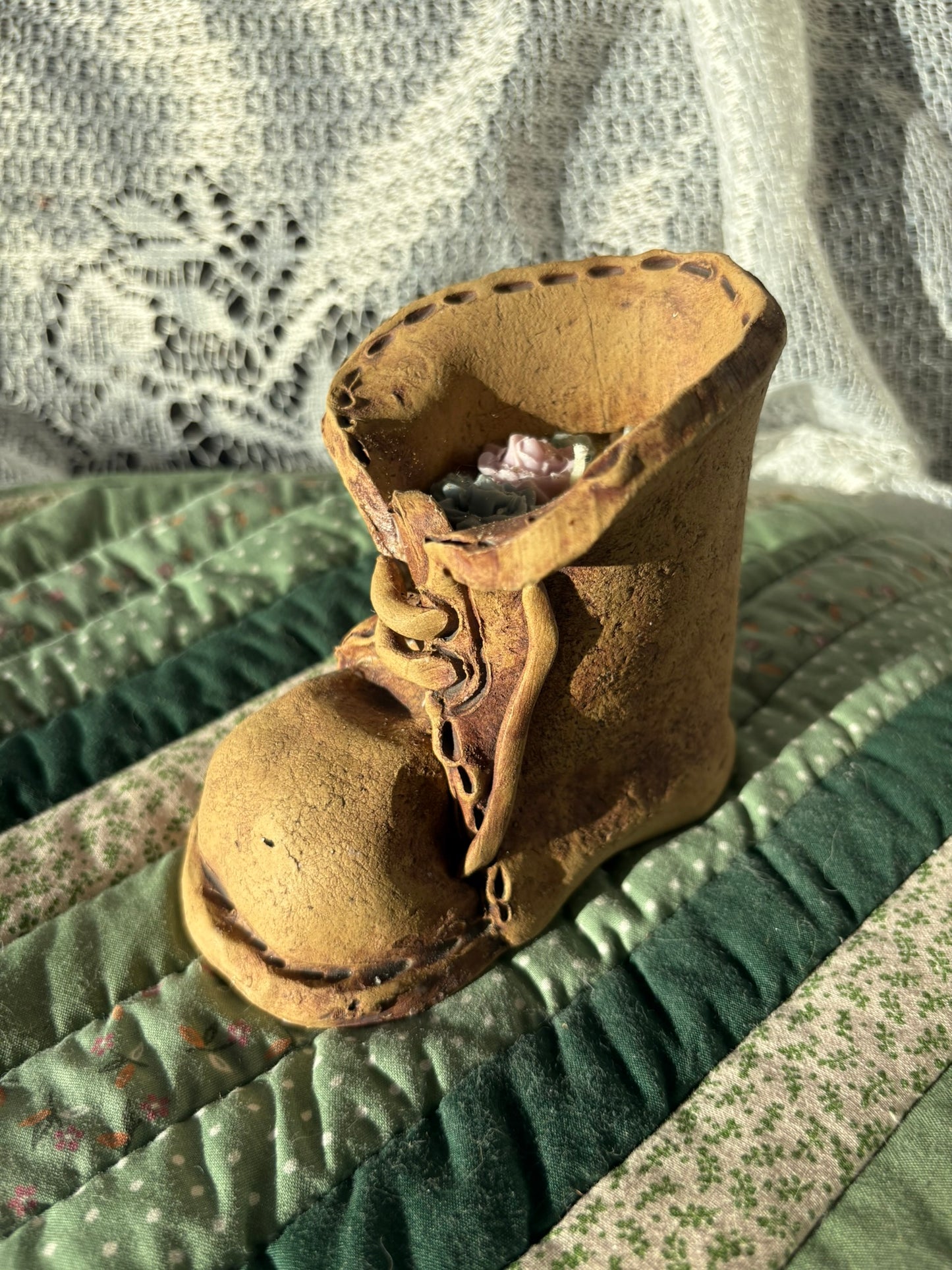 Upcycled boot candle