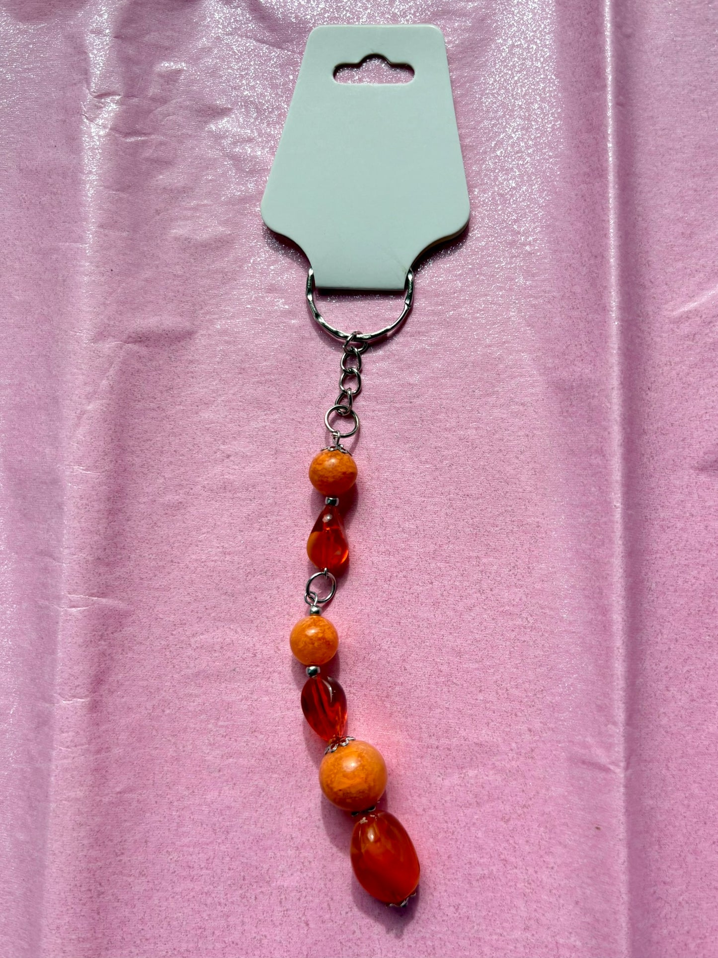 Beaded keychain on a pink background