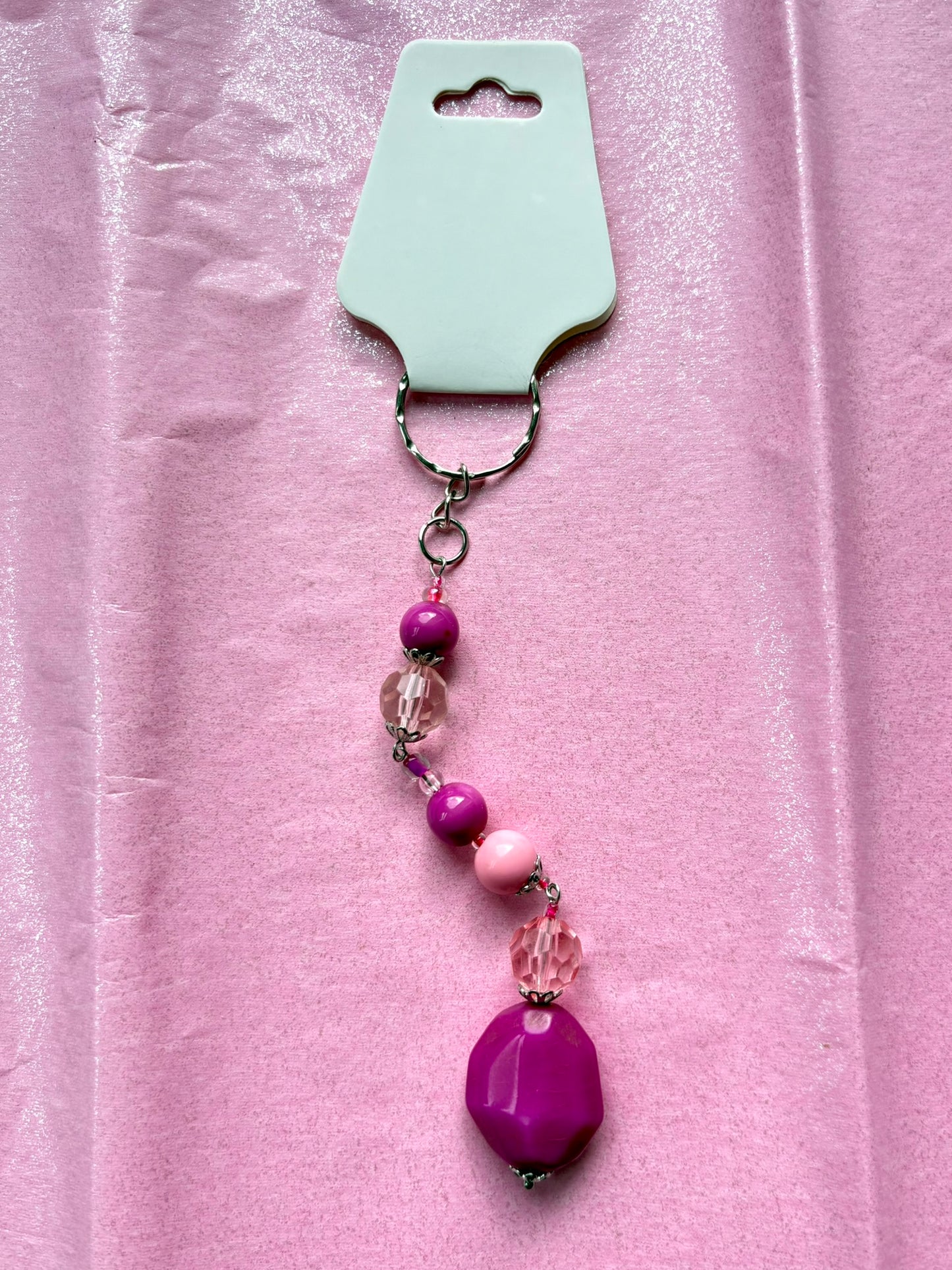 Keychain with beads on a pink background