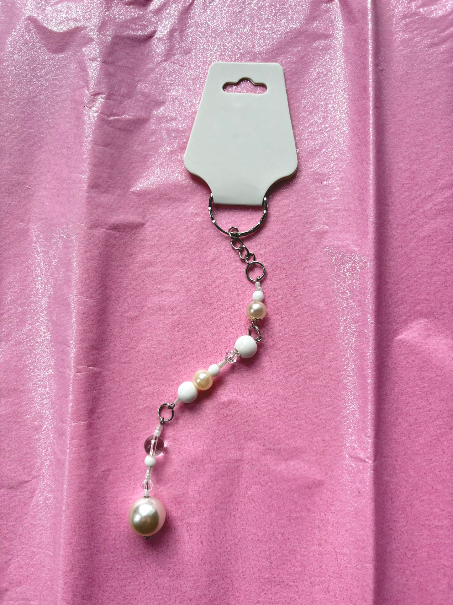 Pearl necklace on a pink background