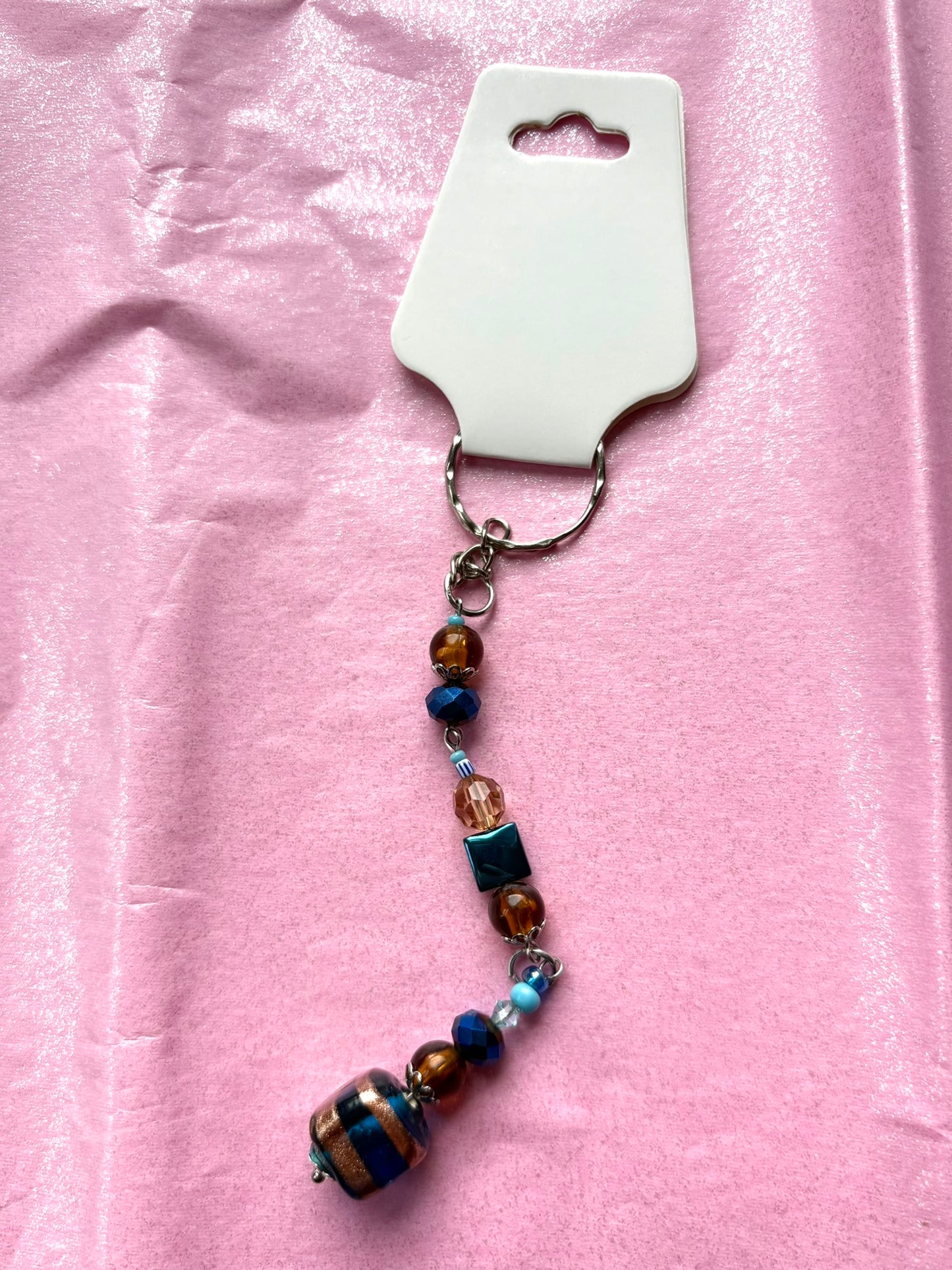 Beaded keychain on a pink background