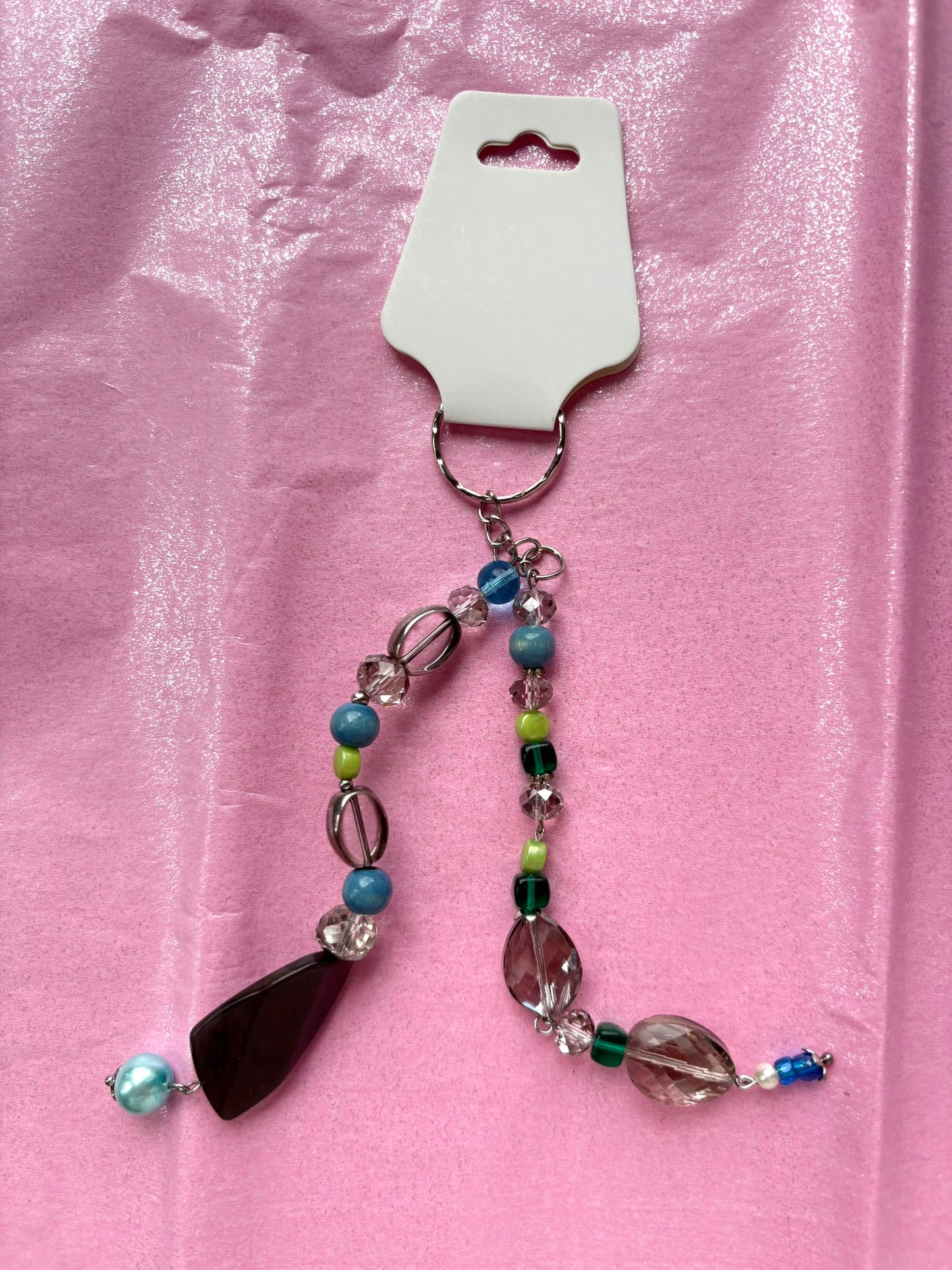 Beaded keychain on a pink background