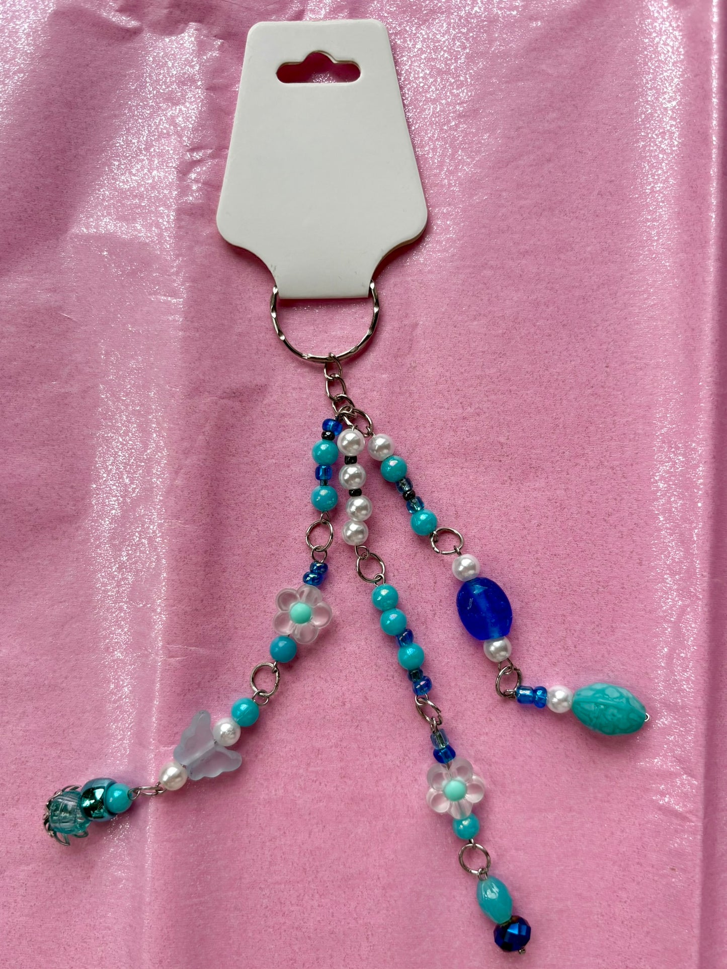 Beaded keychain on a pink background