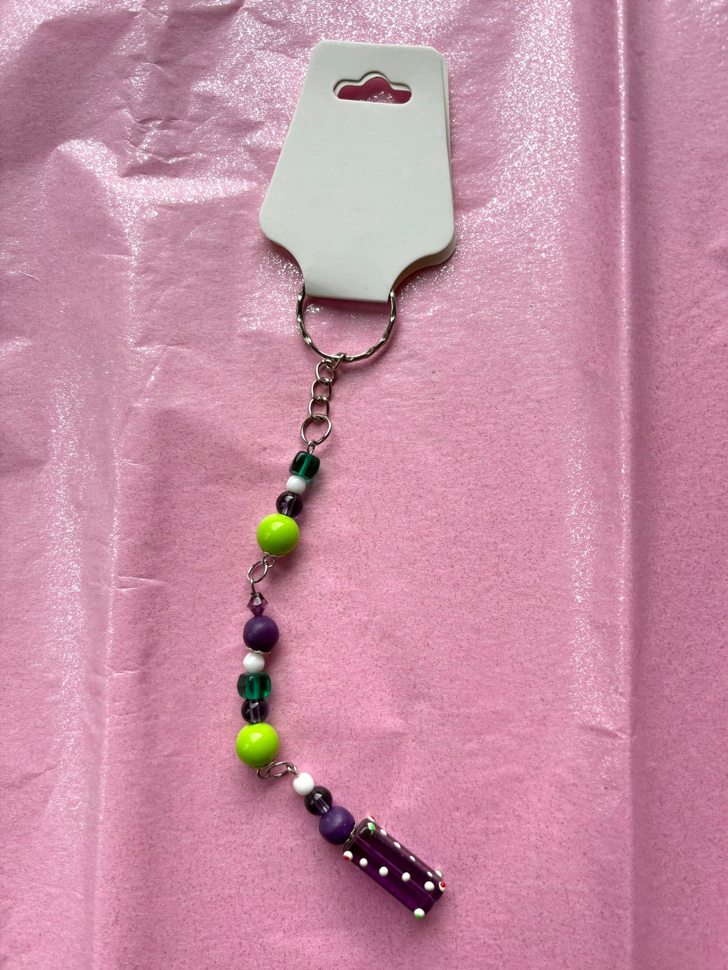 Beaded keychain on a pink background