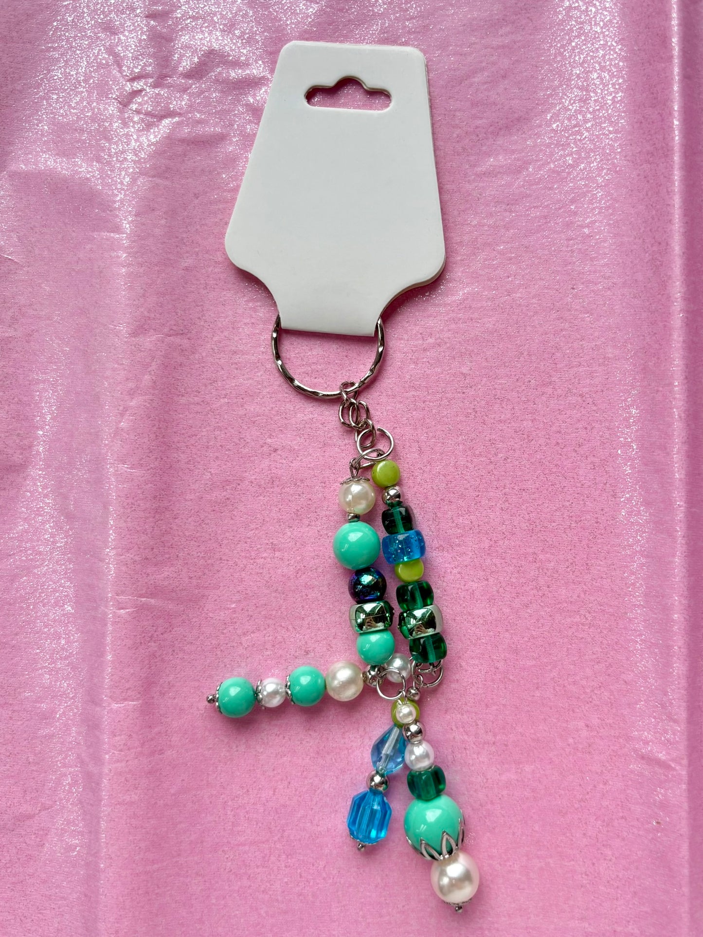Beaded keychain on a pink background