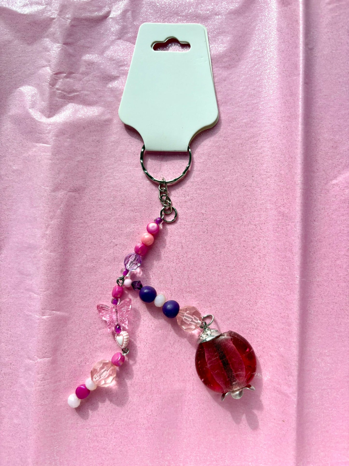 Beaded keychain on a pink background