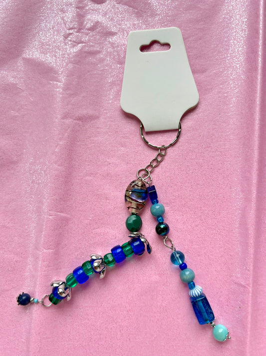 Beaded keychain on a pink background