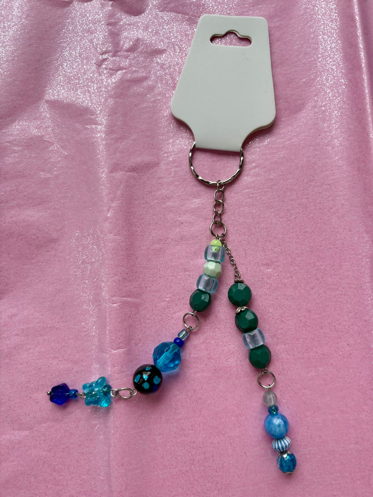 Beaded keychain on a pink background