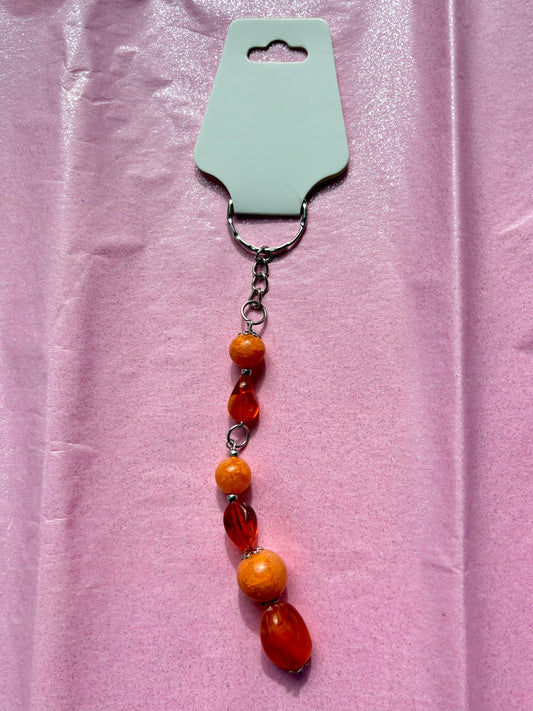 Beaded keychain on a pink background