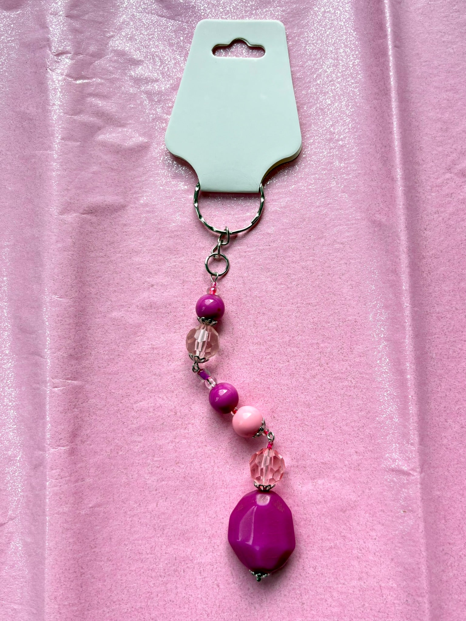 Keychain with beads on a pink background