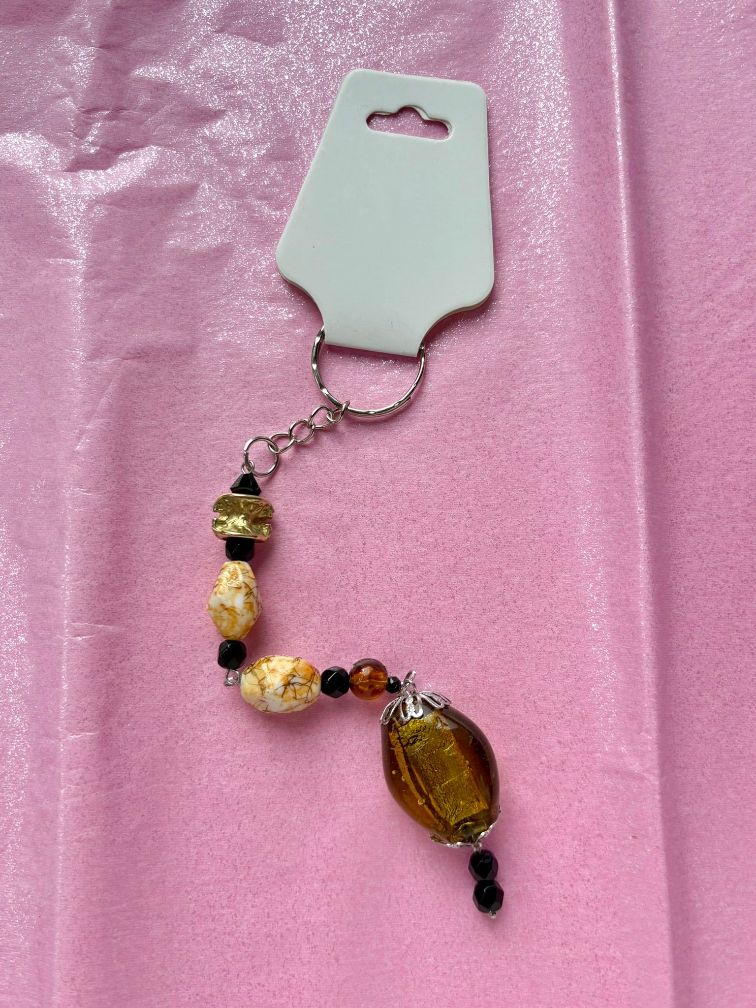 Beaded keychain on a pink background