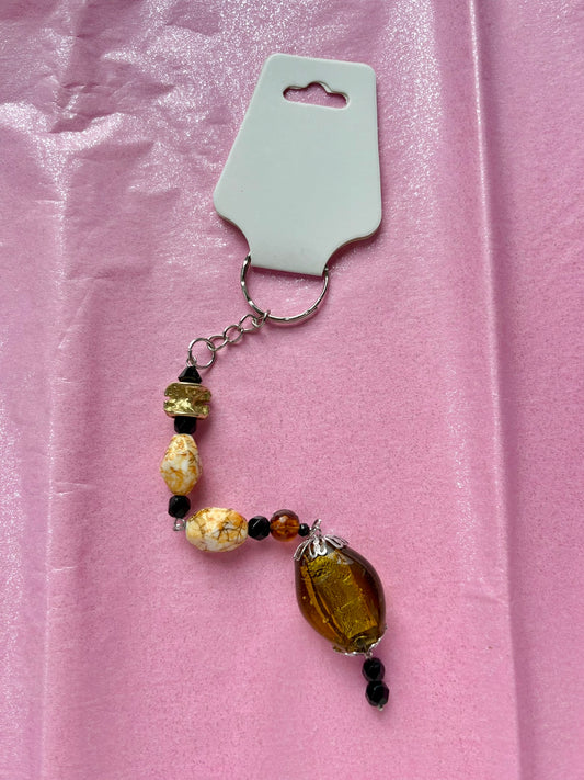 Beaded keychain on a pink background