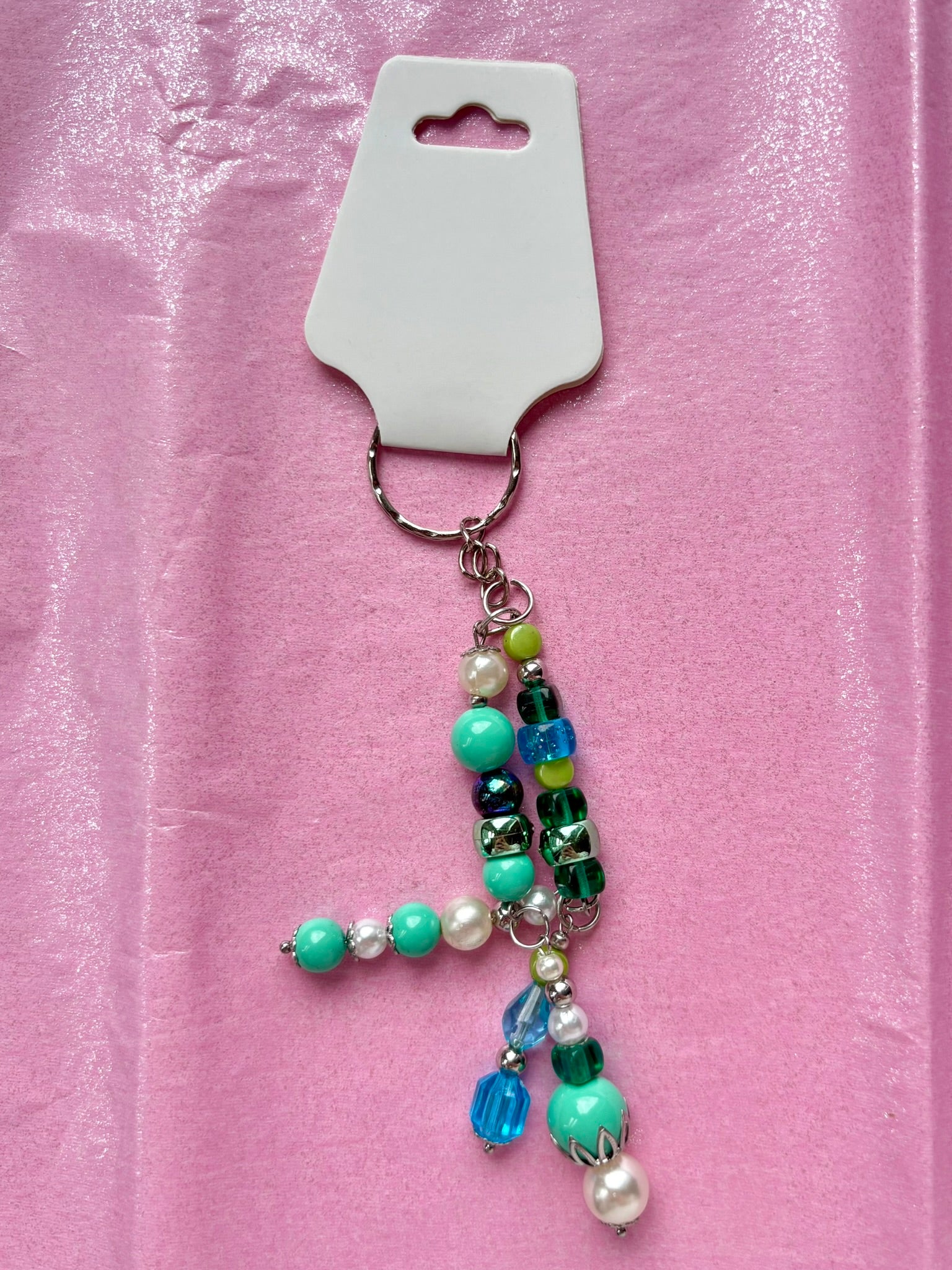 Beaded keychain on a pink background