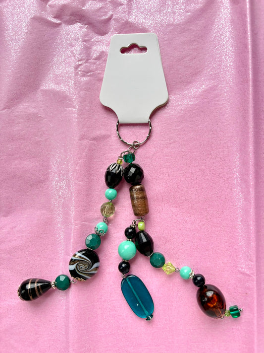 Beaded keychain on a pink background