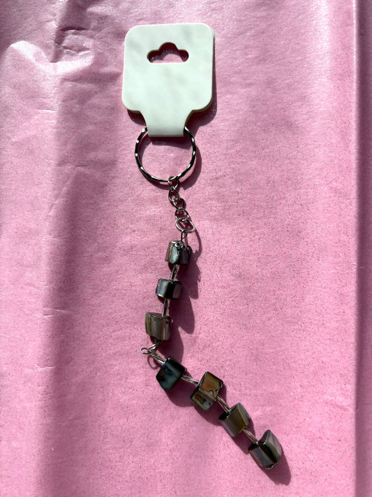 Keychain with beads on a pink background