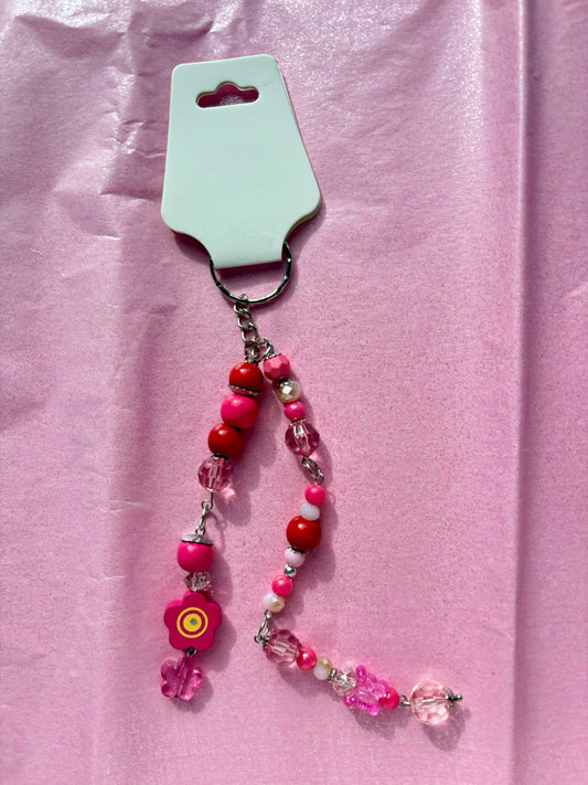Beaded keychain on a pink background